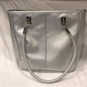 Silver bag. Barely used. Like new.